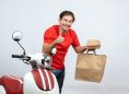 Smiling Delivery Man Red Uniform Standing Near Scooter Holding Bank Card Orders Making Ok Gesture White Background, Takeaway Times Magazine